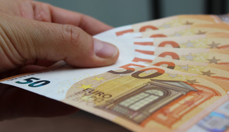 50 Euro Banknotes in Man's Hands