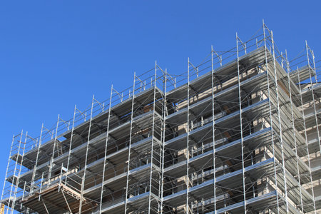 Construction work in progress in the city in summer - building a new condominium