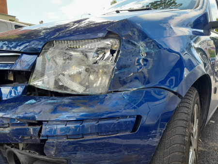 Car to be scrapped due to a head-on collision - businessの写真素材