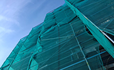 Work in progress on a city construction site in the summer - building a new condominiumの写真素材