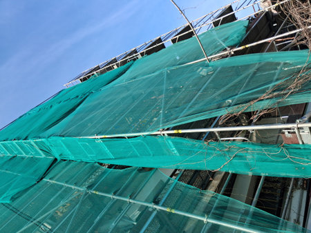 Work in progress on a city construction site in the summer - building a new condominiumの写真素材