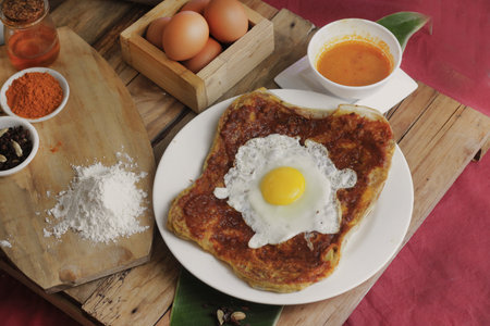 prata canai style style pancake with egg on wood background, Thai foodの写真素材