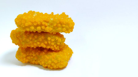 Three crispy chicken nuggets isolated on white backgroundの写真素材