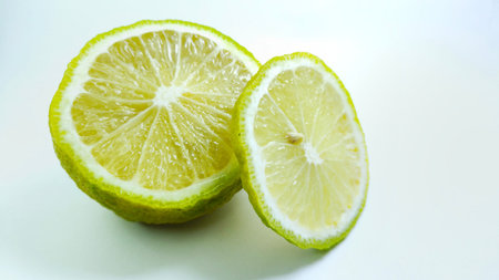 Fresh lime cut in half on white background, good for health. herbal food