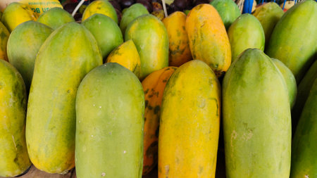 pile of Papaya at fruit stall, fruit stall, healthy food conceptの写真素材