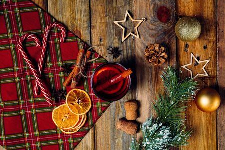 Top view of glass of hot mulled wine on christmas tableの写真素材