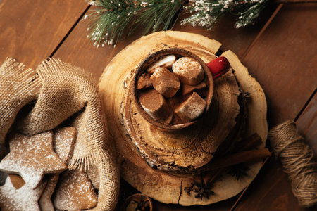 Homemade Cocoa Mug with Marshmallows. Jar of Cocoa Powder on burlap