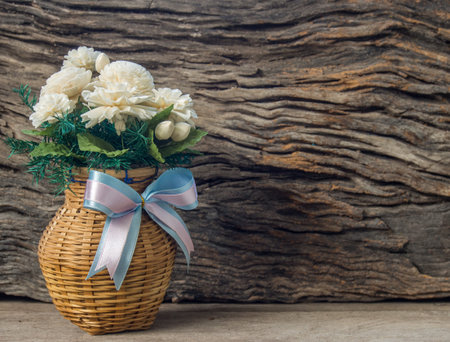 Jasmine Flower in vase on wood background の写真素材