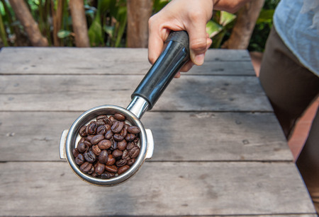 coffee beans in holder for coffee machineの写真素材