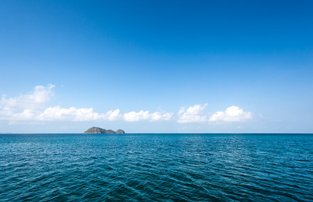 Sea surface and island skyの写真素材