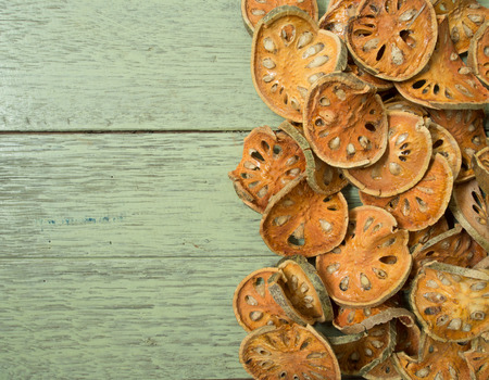 bael dried on wooden floorの写真素材