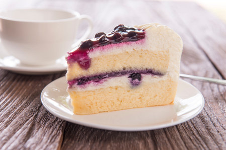 Blue berry cake served on a plate.