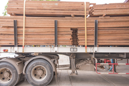 Trucks loaded with lumberの写真素材