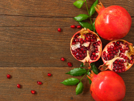 Pomegranate on woood backgroundの写真素材