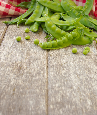 peas on wooden backgroundの写真素材