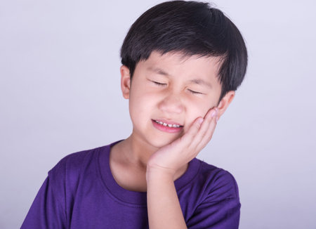 The boys having a toothacheの写真素材