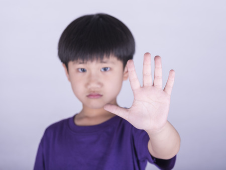 boy showing him denial with NO on him handの写真素材