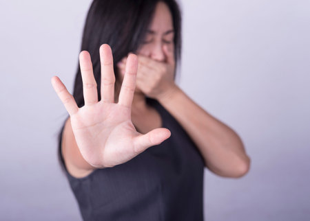 woman showing her denial with NO on her hand