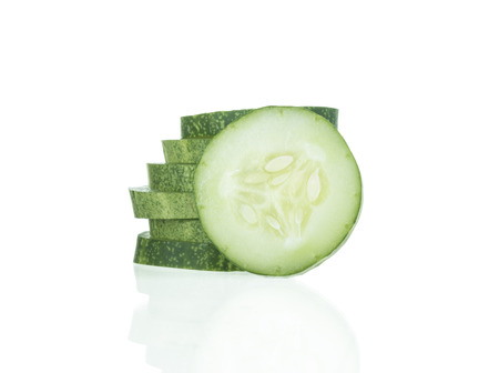 Fresh cucumber and slices on white background.の写真素材