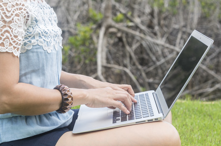 young women using laptop computer at home. technology concept, freelance concept, business concept, shopping online concept. Selective focus.の写真素材