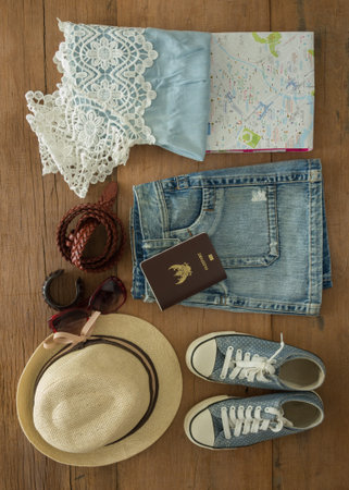 Outfit of traveler, student, teenager, young woman. Top view of clothing and accessory for women.の写真素材