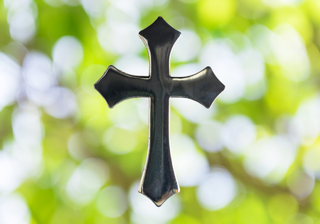 Holy Cross and bokeh background with natural light.の写真素材