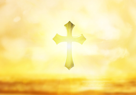 Holy Golden Cross and light on a bokeh background.の写真素材