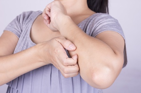 Women scratch the itch with hand. Concept photo with Healthcare And Medicine.の写真素材