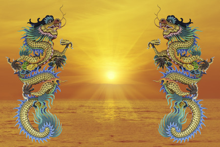 Chinese style dragon statue, blurred background sea evening before sunset.. - can be used for display your products or promotional and advertising posters.の写真素材