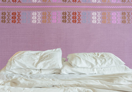 Bedding sheets and pillows up after nights sleep isolate on white blackground.