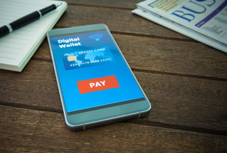Digital wallet in your smartphone is placed on a wooden table. Business concepts and technology.