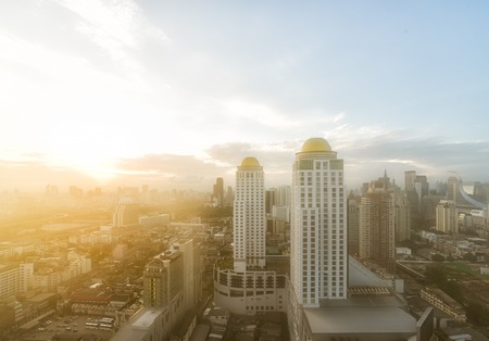 Cityscape, Aerial view of Bangkok skyline with fog and morning sun bokeh of fresh air.の写真素材