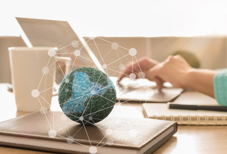 mock up the globe with digital social media network on notebook at office background.
