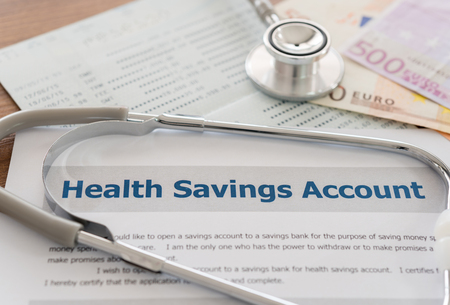 health savings account HSA concept with application form,euro money, stethoscope, bank account on desk.の写真素材