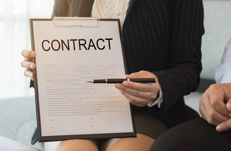 Business people or lawyer sends pen and contract document for signing contract.
の写真素材