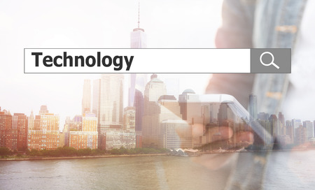 Technology concept, using text search. technology against the background of the phone in the city.の写真素材