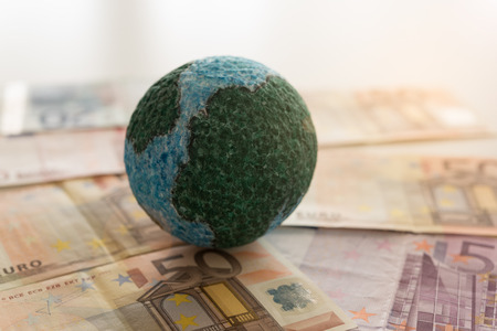 global money, Mock up globe on euro banknote. concept of foreign exchange market, finance and banking international.の写真素材