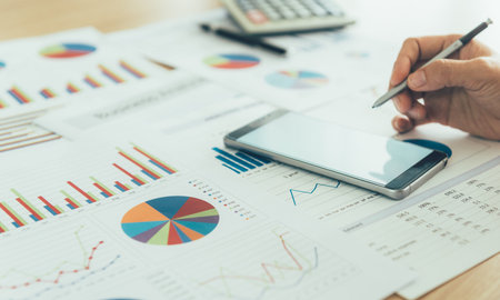 Account manager are using a stylus pen to take notes on their smartphone. Communication and Technology Conceptsの写真素材