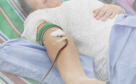 blood donation concept. donor giving blood transfusion in hospital. 14 th june world blood donor day.の写真素材