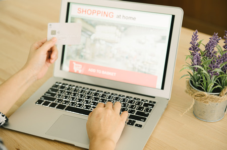Women use laptops and credit cards to order online. Technology Concepts and Modern Lifeの写真素材