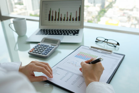 Accounting financial spreadsheet. Business women prepare business report for evaluation performance.
