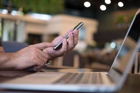 Internet of things. people using a mobile phone and laptop computer with internet go to the web.の写真素材