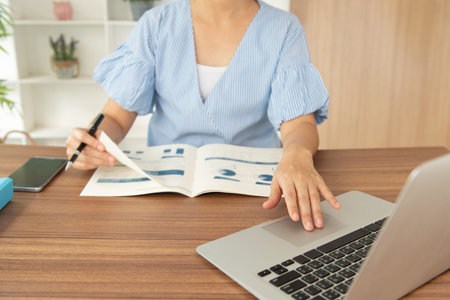 women using computer prepare business report for data analysis.
working from home concept.