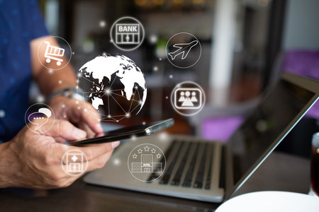 Businessman use a smartphone with IOT, internet of things conceptual sign, internet era, internet in...