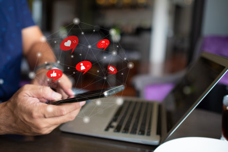 Social media, social network concept. People using a smartphone at cafe interact with social media.の写真素材