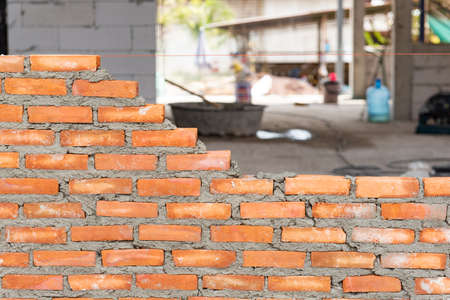 Red brick wall in construction siteの写真素材