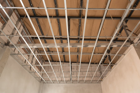Aluminum c-lines ceiling panels installed under the roof. Construction concept..