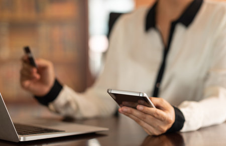 Mobile banking network. businesspeople using a mobile phone with credit cards online payment.