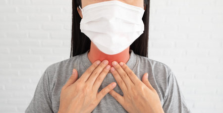 Coughing, sore throat in flu. Young asian women wearing masks to protect from airborne respiratory...
