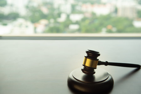auction hammer or judge gavel on law desk with copy space.の写真素材